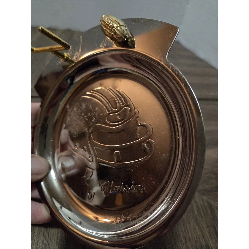 silver-tone and brass football 